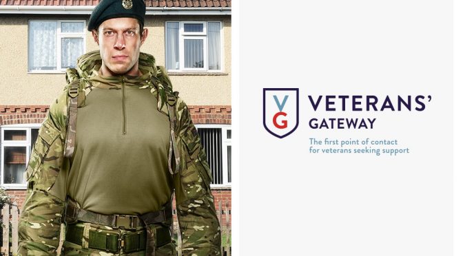 Man in uniform stood in front of a house with the Veterans' Gateway logo