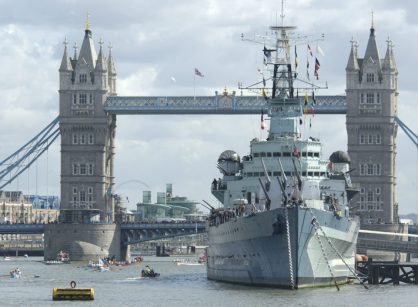 Royal Navy ship in front of Tower Bridge
