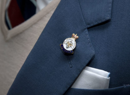 A Veteran's Badge being proudly worn on a lapel.