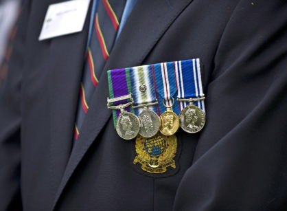 A veteran of the Falklands Conflict wears his medals with pride at a memorial service for the 30th anniversary of the conflict.