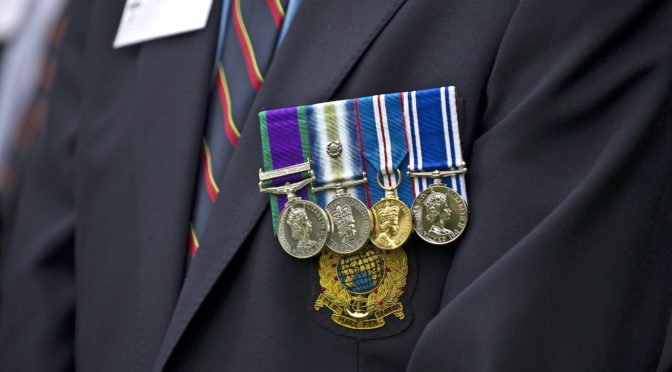 A veteran of the Falklands Conflict wears his medals with pride at a memorial service for the 30th anniversary of the conflict.
